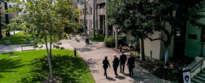 people walking across campus