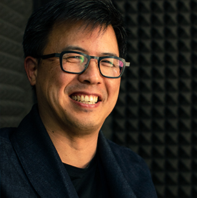 Smiling John Chan during Conversing podcast recording