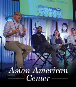 Daniel Lee on stage with three people and the text Asian American Center
