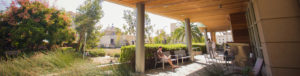 man sitting outside of library