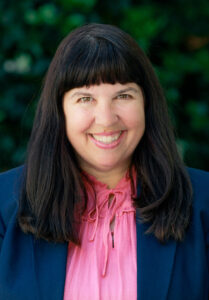 Headshot of Mary Glenn, smiling